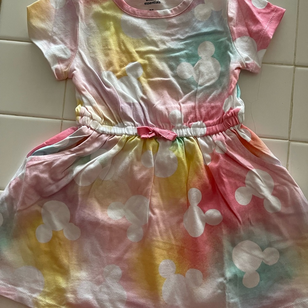 Amazon Essentials Disney Kids Dress (w/pockets) with two tops and two leggings.